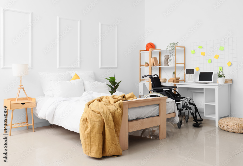 Obraz premium Interior of student's bedroom with wheelchair and table