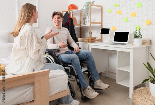 Male graduate in wheelchair...