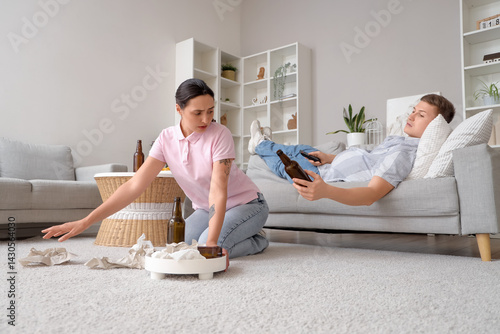 Stressed wife cleaning tras...
