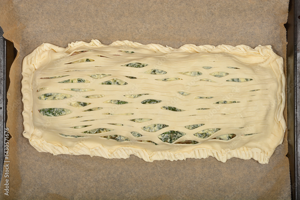 A close-up, top-down shot shows a dense arrangement of pickled cucumbers on a light surface