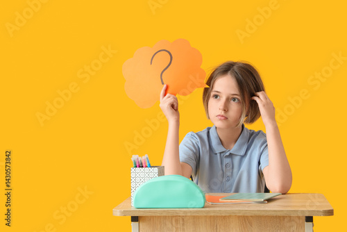 Thoughtful schoolboy with s...