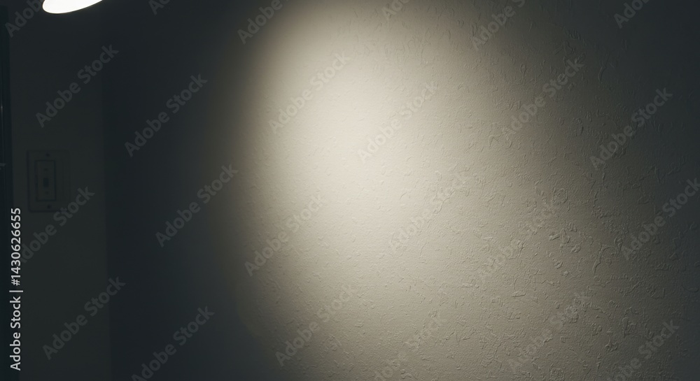 Naklejka premium Interior Wall with Light Cast by a Ceiling Fixture