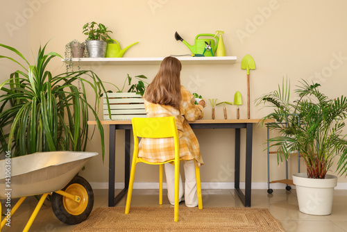 Female gardener with plant ...