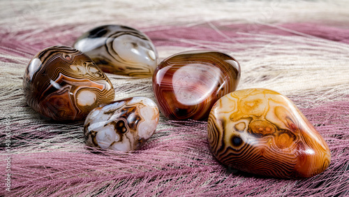 Polished agate stones on textured fabric