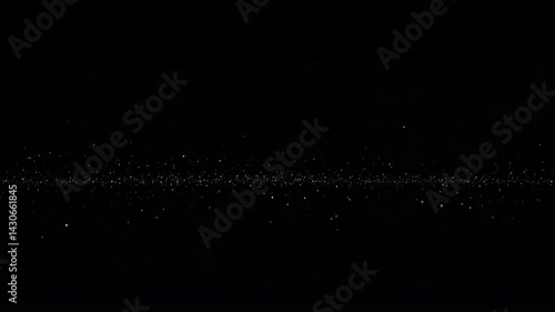 Faint glowing particles float gently across a dark background  