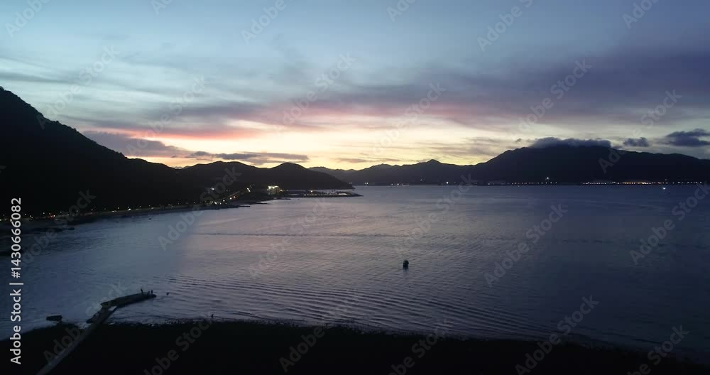 Sunset over Yangmeikeng captures vibrant colors and stunning aerial views of a serene coastal landscape
Sunset over Yangmeikeng captures vibrant colors and stunning aerial views of a serene coastal landscape