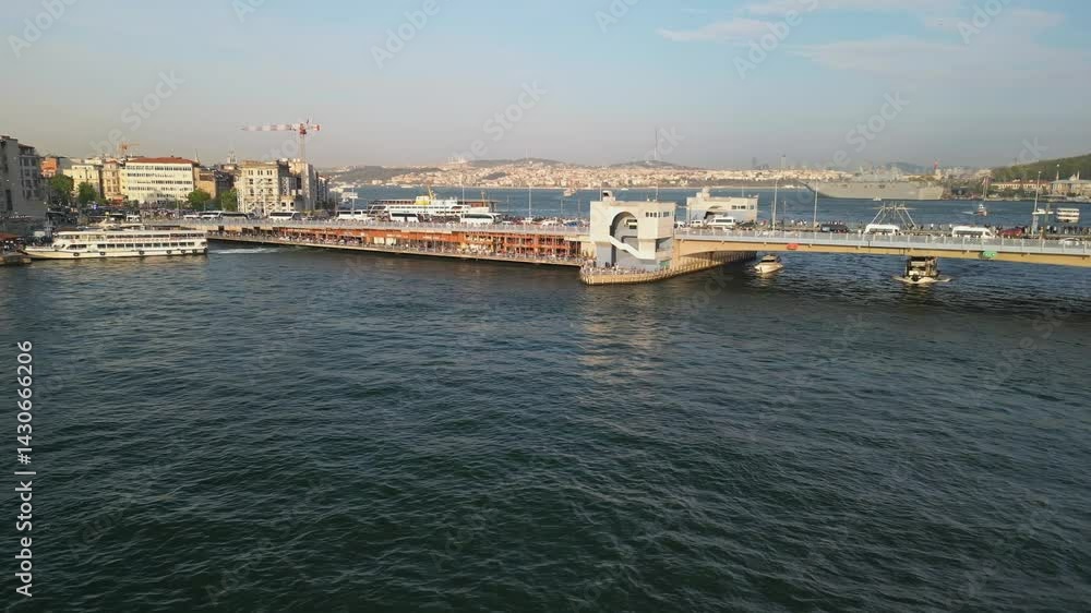 Side flight near Galata Bridge with ferries and busy Istanbul waters Side flight near Galata Bridge with ferries and busy Istanbul waters