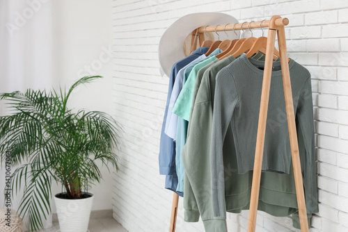 Rack with clothes and house...