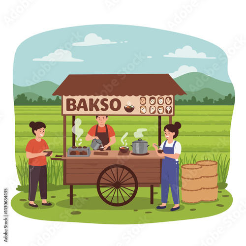 Food Vendor Cooking Bakso at Cart with Customers on Field