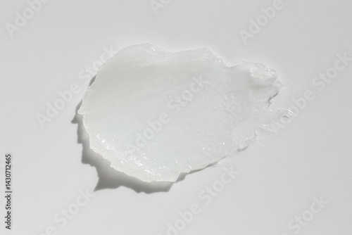 Tableau sur toile Moisturizing lip balm on white background, top view