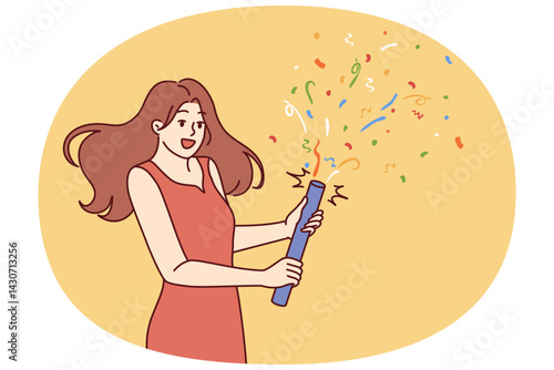 Woman launches confetti during birthday or university graduation party. Girl in beautiful evening dress holds firecracker with confetti, wanting to cheer friends gathered at festive disco