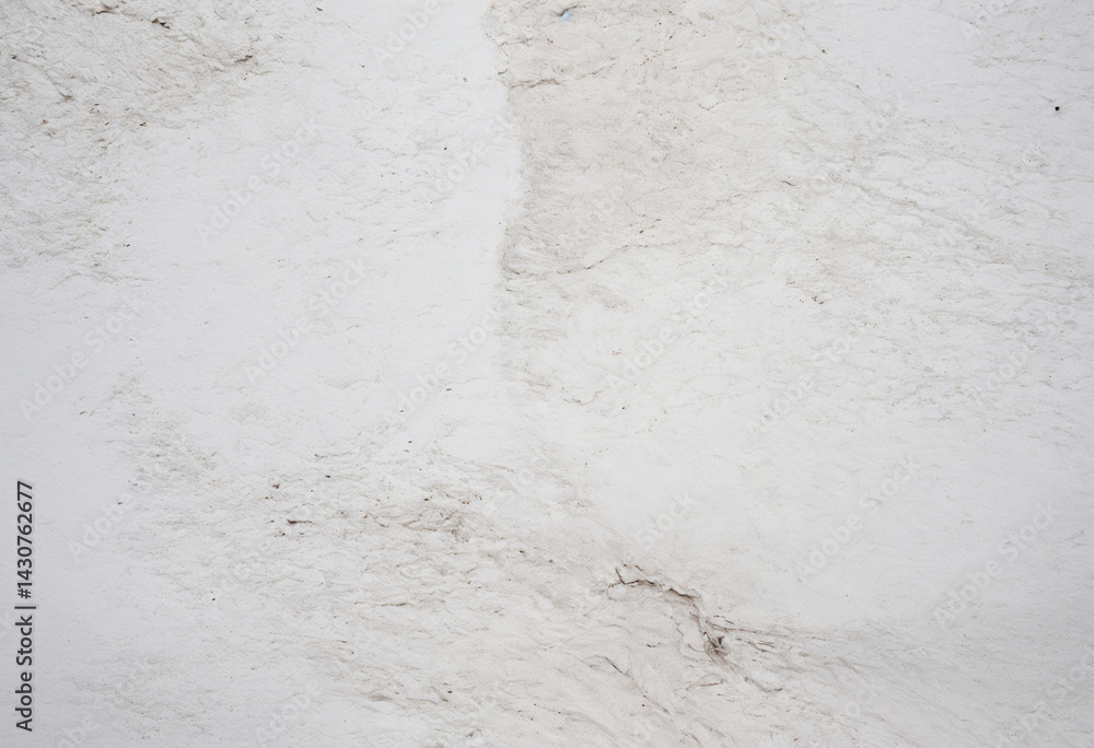 Fototapeta premium Closeup of a white wall, great for backgrounds, construction websites, interior design blogs, minimalist concepts, and texture references.
