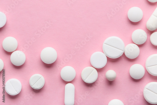 Different white pills on pi...