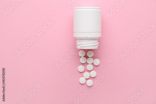 Jar with white pills on pin...