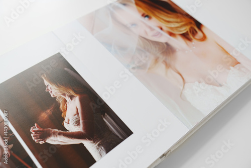 the pages of a photo book with wedding photos. 