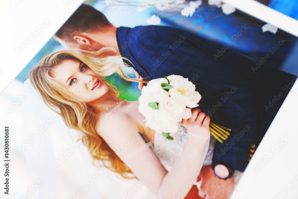 the pages of a photo book with wedding photos.