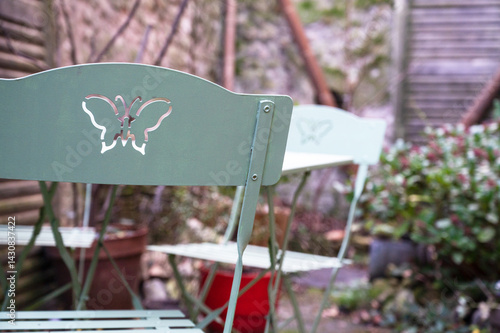 Two Metal Chairs in Garden – Elegant Outdoor Seating