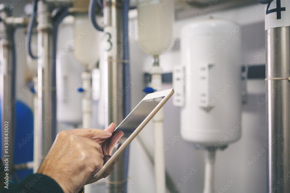 Naklejka premium Senior maintenance engineer checking the system in the boiler room