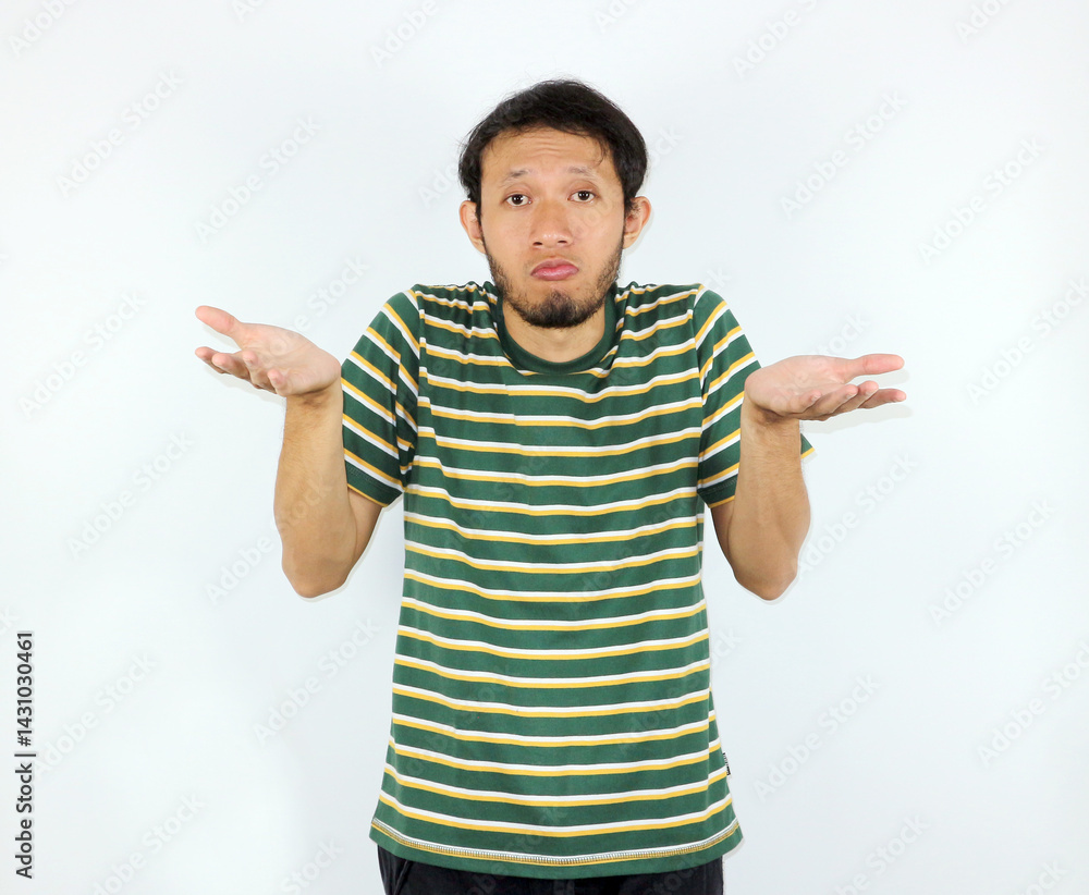 Man Shrugging Shoulders with Questioning Expression on Plain White Background Man Shrugging Shoulders with Questioning Expression on Plain White Background