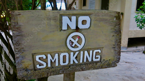 No Smoking Sign. A wooden sign with the words 