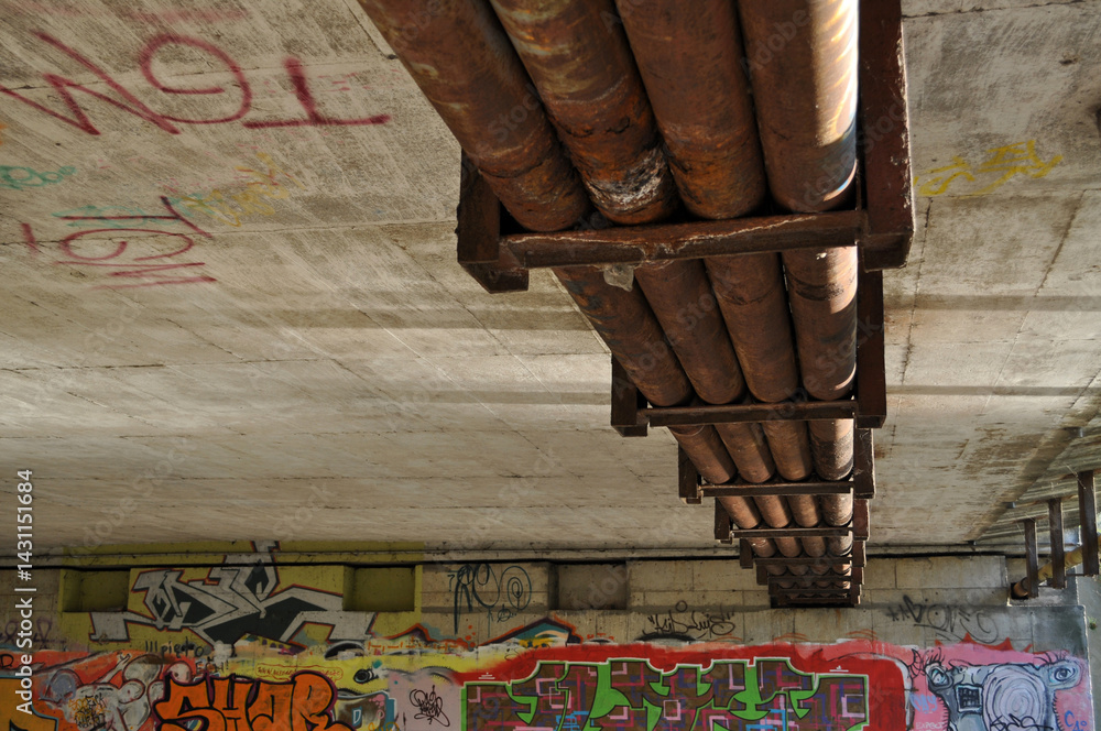 underpass under the bridge next to the stream of the river