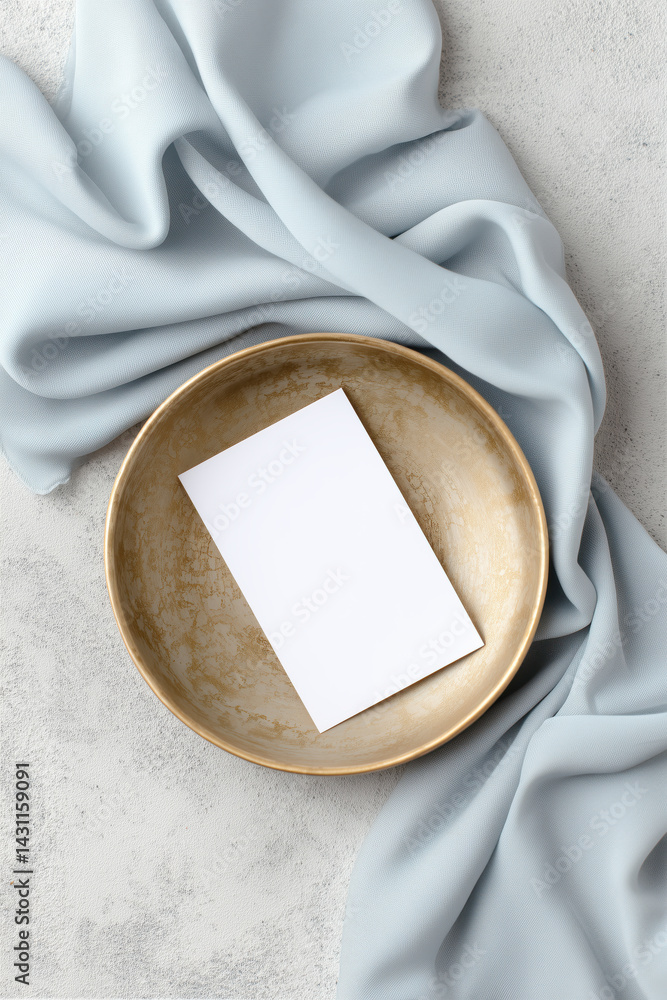 Blank card mockup on a gold tray decorated with blue linen runner.