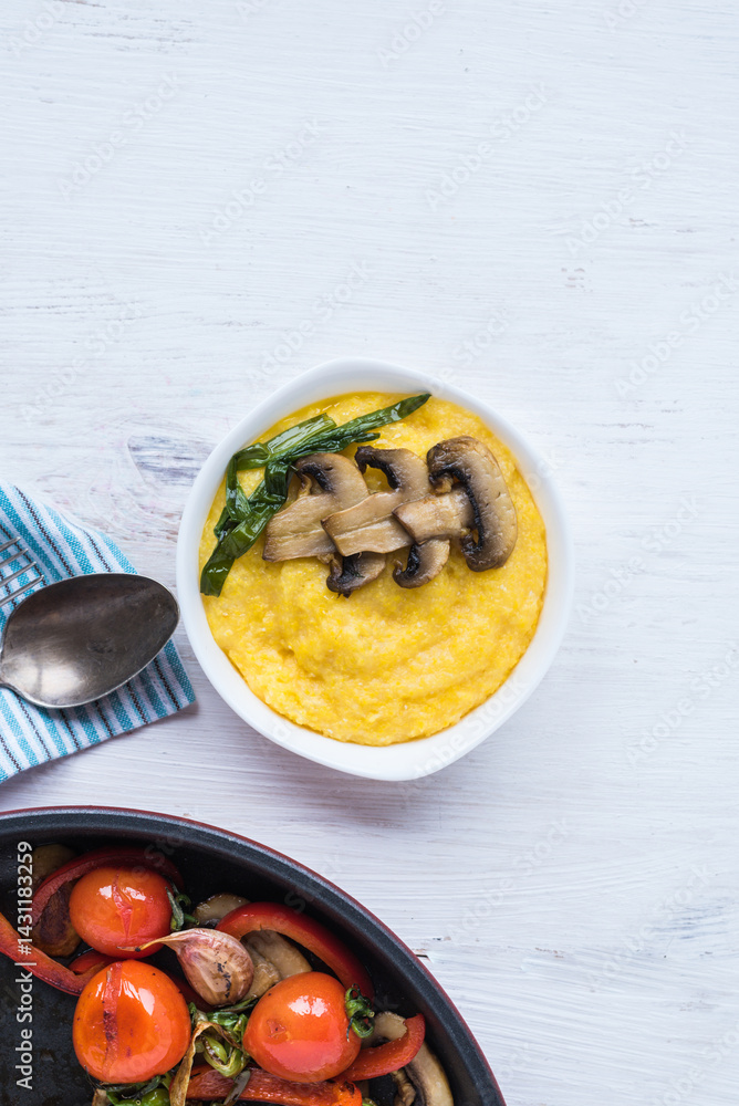 Grilled vegetables in a frying pan and porridge with corn grits. Healthy food for every day. Grilled vegetables in a frying pan and porridge with corn grits. Healthy food for every day.