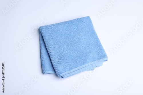 Clean towel on white background, above view