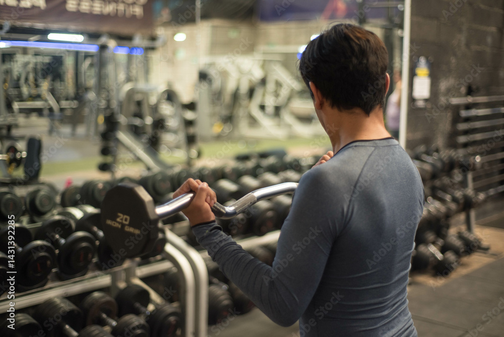 Bodybuilder doing barbell exercises in the gym. Bodybuilder doing barbell exercises in the gym.