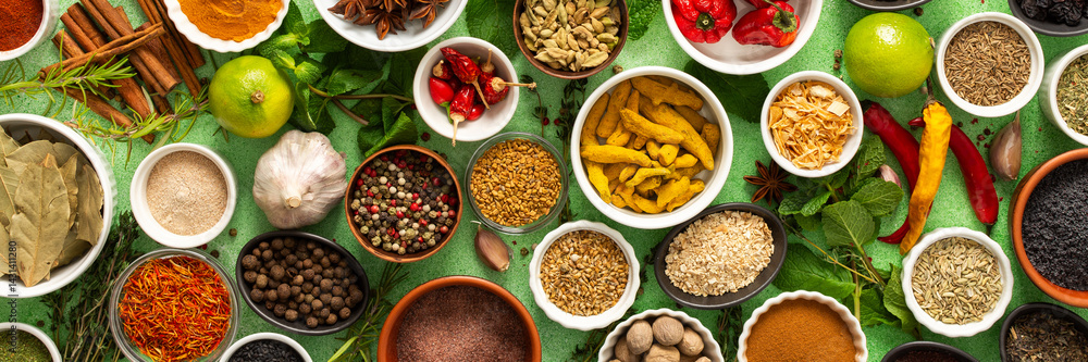 A beautiful collection of colorful spices and herbs, showcasing their natural aromas and vibrant hues on a gentle green background, banner A beautiful collection of colorful spices and herbs, showcasing their natural aromas and vibrant hues on a gentle green background, banner
