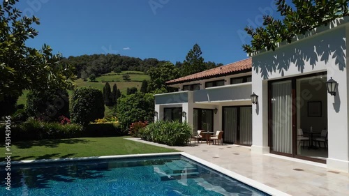 Wallpaper Mural Luxurious Villa Retreat Surrounded by Lush Green Scenery and Pool Torontodigital.ca