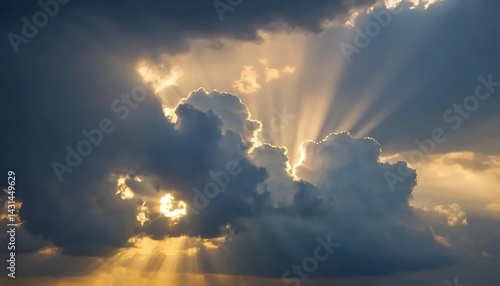 Sunlight streaming through dramatic clouds creating a beautiful and ethereal sky landscape view