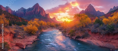 River flows through a canyon with mountains and trees at sunset.