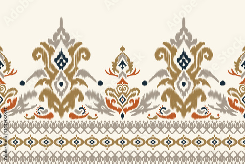 Seamless ikat border pattern with floral details in shades of olive green, blue and burnt orange. Perfect for traditional handcrafted wall art, bohemian projects and home decor themes.