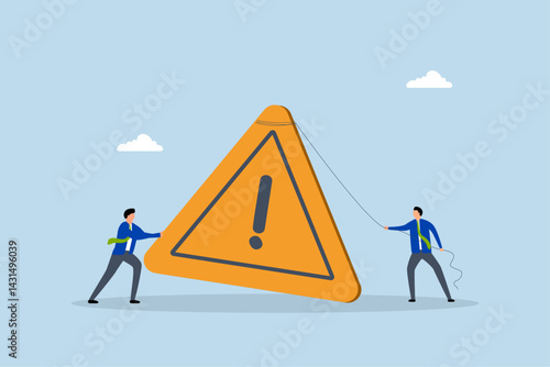 Attention message, businessman pushing exclamation triangle attention sign.