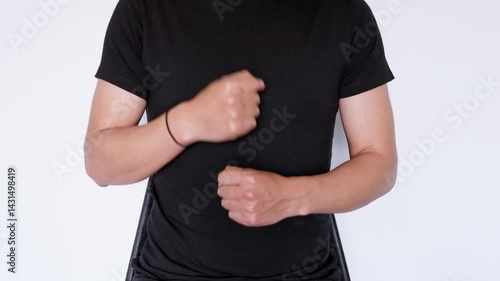 Sign language for work. Man wearing a black polo shirt sitting on a white background.