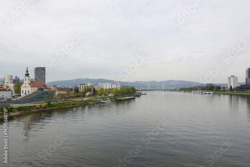Obraz na płótnie A riverside embankment in Linz, the river Danube, Austria w salonie