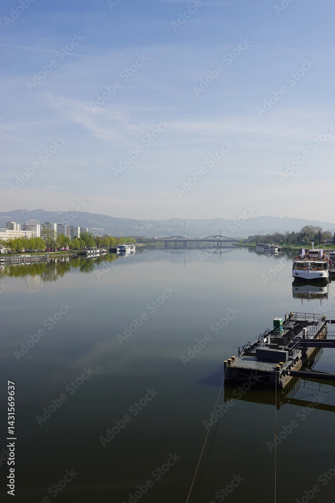 Fototapeta premium A riverside embankment in Linz, the river Danube, Austria 