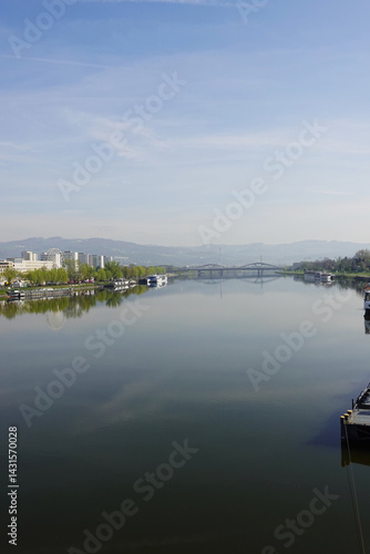 Obraz na płótnie A riverside embankment in Linz, the river Danube, Austria w salonie