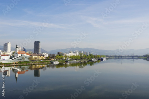Obraz na płótnie A riverside embankment in Linz, the river Danube, Austria w salonie