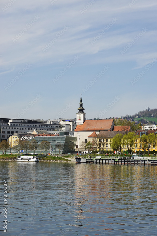 Obraz premium A riverside embankment in Linz, the river Danube, Austria 