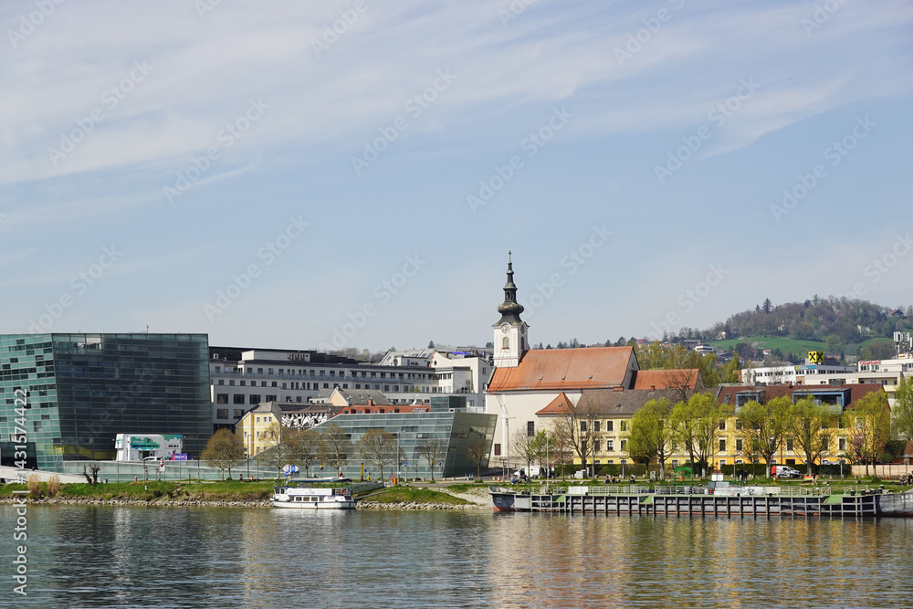 Naklejka premium A riverside embankment in Linz, the river Danube, Austria