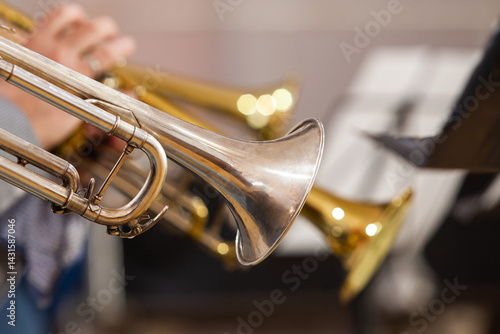 Close-up of a fragment of trumpets in an orchestra