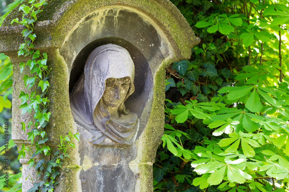 Historic Statue on the spring mystery old Prague Cemetery, Czech Republic