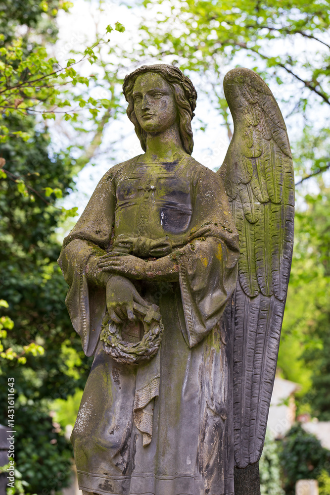 Historic Statue on the spring mystery old Prague Cemetery, Czech Republic