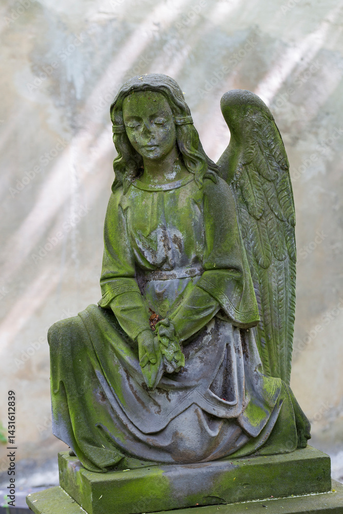 Historic Statue on the spring mystery old Prague Cemetery, Czech Republic