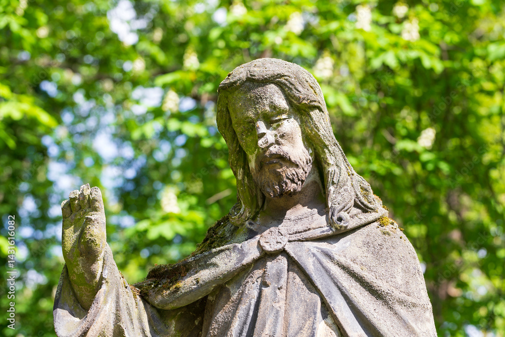 Historic Statue on the spring mystery old Prague Cemetery, Czech Republic