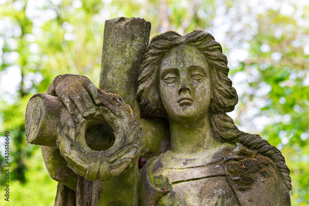 Historic Statue on the spring mystery old Prague Cemetery, Czech Republic