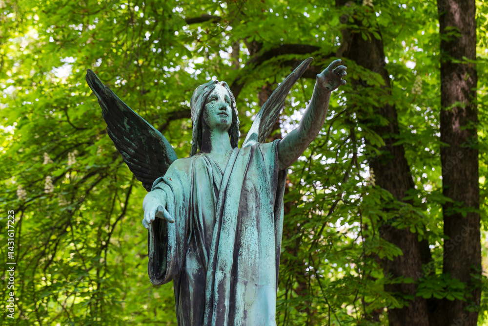 Historic Statue on the spring mystery old Prague Cemetery, Czech Republic