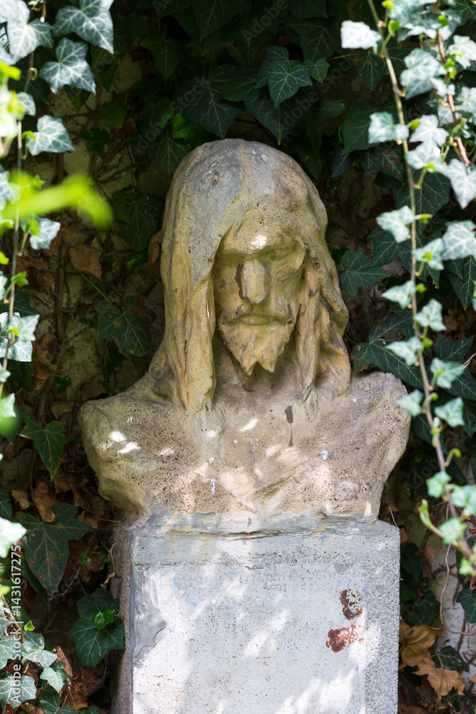 Historic Statue on the spring mystery old Prague Cemetery, Czech Republic